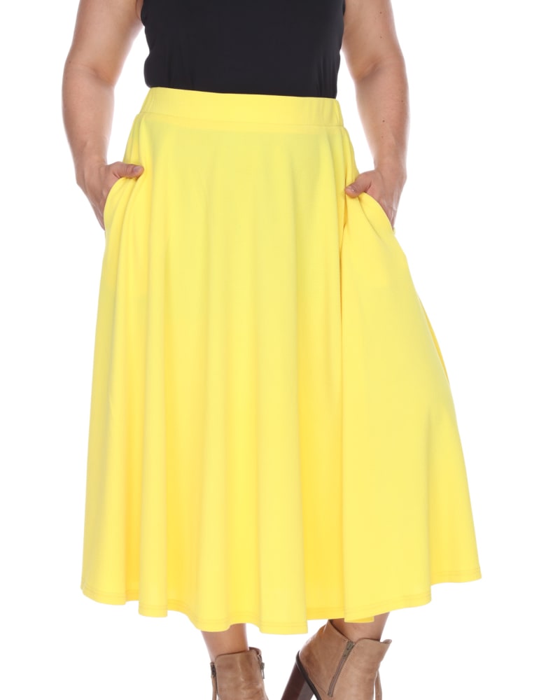 Front of a model wearing a size 2X Tasmin Flare Midi Skirt in Yellow by White Mark. | dia_product_style_image_id:249186
